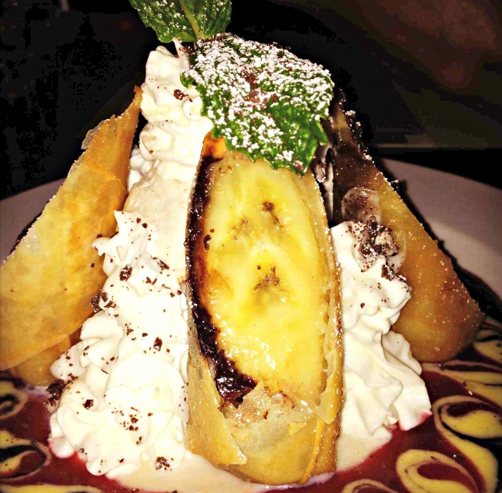 Banana Bomb: Tempura fried banana & dark chocolate wrapped in spring roll skin served with vanilla ice-cream, sliced almonds & assorted sauces